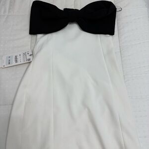Elegant Black and White Strapless Dress with Bow